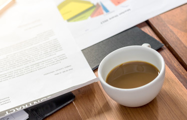On the desk in office and hot coffee in morning