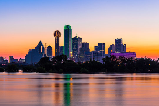 Dallas skyline at sunrise with water reflections