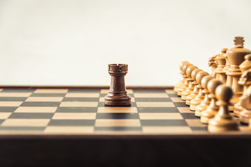 Chess on board  white backgroung. Confrontation concept