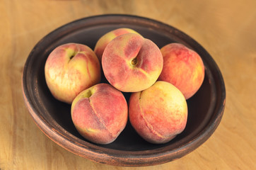 Peaches in Brown ceramic plate