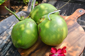 Fresh Young coconut on wood background