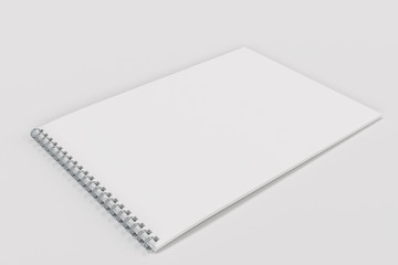 Blank white notebook with metal spiral bound on white background