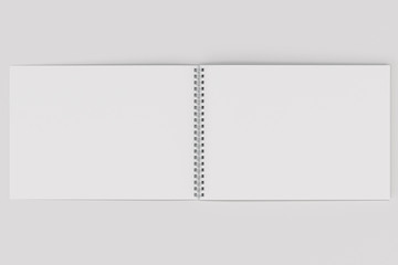 Open blank white notebook with metal spiral bound on white background - 163608815
