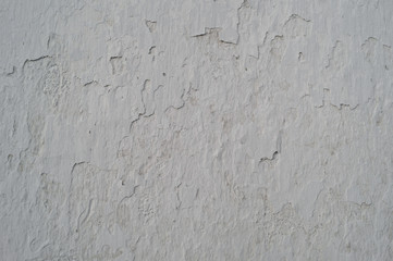 Old cracked wall covered grey plaster, background, texture