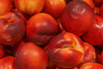 Obraz na płótnie Canvas Fresh, ripe, juicy peaches in a box.