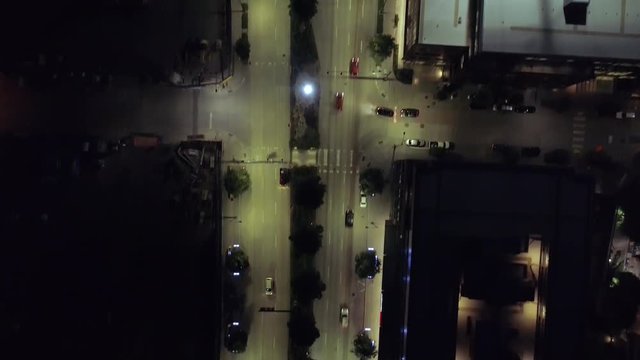 Birds Eye View on Downtown City Streets Alive with Cars Driving at Night