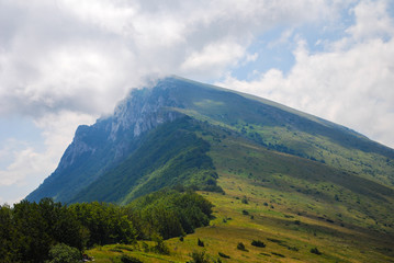 Obraz na płótnie Canvas Summer mountain landscape, dynamic summer sky above the mountains. Dry mountain, Serbia, green mountain in summer 