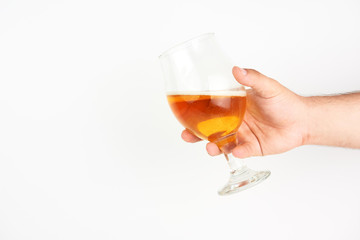 Hand Holding A Glass Of Beer On White Background
