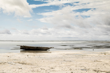 Wood boat in low tide in Zanzibar, Tanzania
