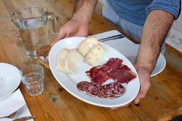 Showing Italian salami and cheese mountain plate