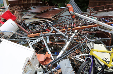 dump of ferrous material with many rusty and unusable objects