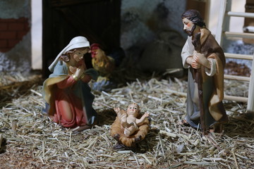 nativity scene with holy family in a stall