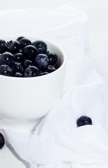 Blueberry in a white mug closeup.