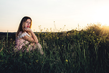 Portrait of beautiful girl in field