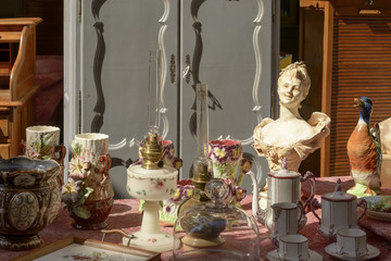 bright light on vintage objects at street market, Chiavari , Italy