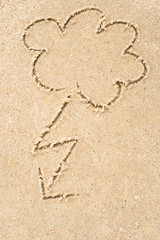 stormy clouds drawing in sand