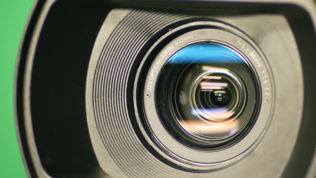 TV camera in motion with lens zoom