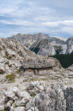 Old wooden abandoned hut on the mountaineering trail in Austia