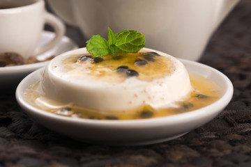 Panna cotta dessert with passion fruit and mint