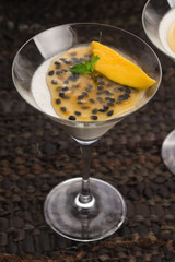 Panna cotta dessert with passion fruit and mint