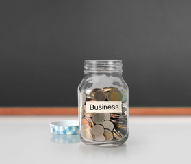 Silver coins in piggy bank Glass