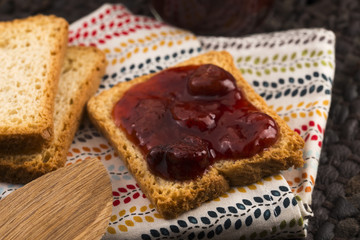 Fototapeta na wymiar Breakfast of cherry jam on toast