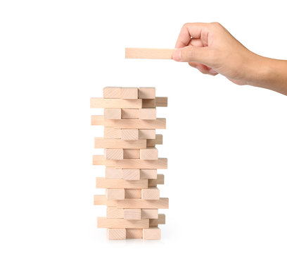 hand playing wood blocks stack game