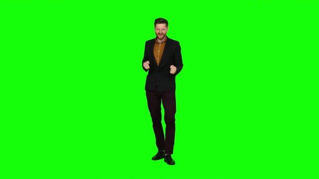 Guy is happy with his victories, he is happy. Green screen