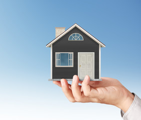 Mortgage concept by house from in hand