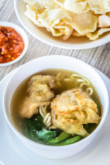 noodle soup with fried dumpling and vegetables
