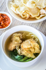 noodle soup with fried dumpling and vegetables