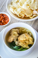 noodle soup with fried dumpling and vegetables