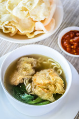 noodle soup with fried dumpling and vegetables