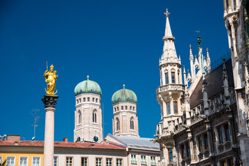 Fototapeta na wymiar New Town Hall, Frauenkirche and golden statue of the Virgin Mary, Munich.