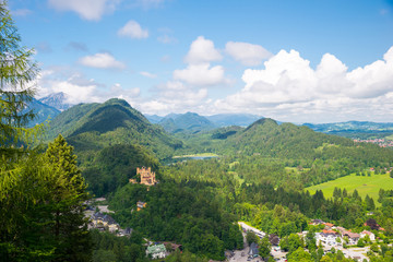 Castle Hohenschwangau, eternal forest with mountains of Bavaria, Germany.