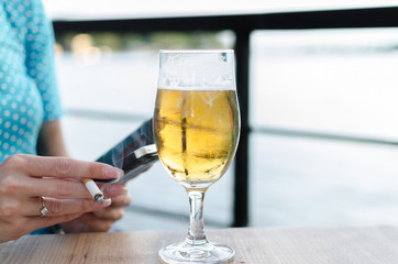 woman drinking and smoking