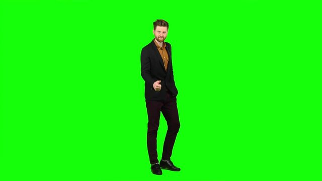 Male businessman showing thumbs up, he likes everything. Green screen