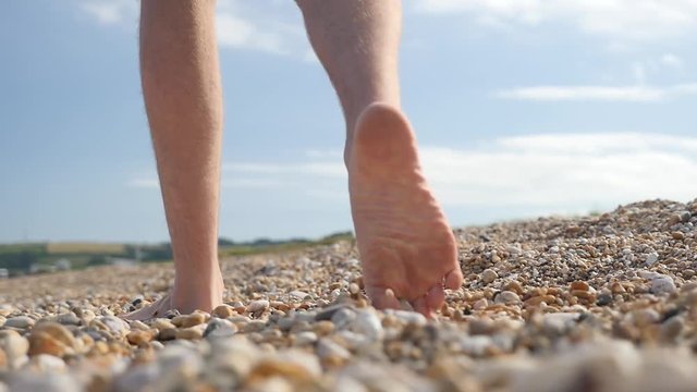 Walking along beach, slow motion