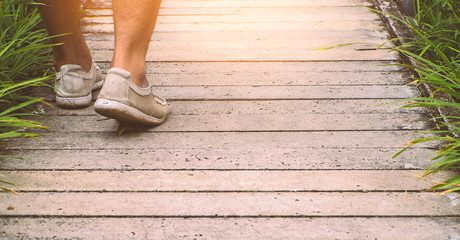 man walking on the way with sneaker shoes