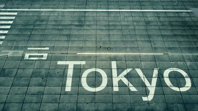 Aerial view of commercial plane landing at Tokyo airport. Travel to Japan conceptual 4K intro animation