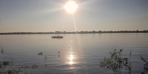 shore of the Volga river at sunrise in the sun