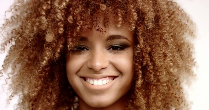 closeup of black mixed race woman lift up ahead and watching at camera