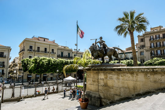 A view of the Piazza Verdi and the Teatro Massimo in Palermo . Sicily