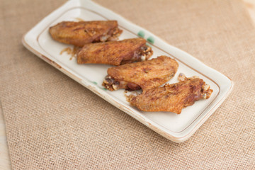 Fried chicken wings and crispy garlic in plate