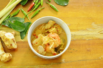 spicy prawn and fish tom yum soup in bowl