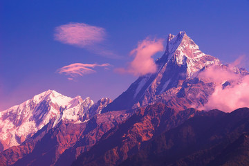 Machapuchare mountain sunset view from Poon Hill with blue sky background. Nepal landscape, Annapurna circuit, Himalaya, Asia. Horizontal view