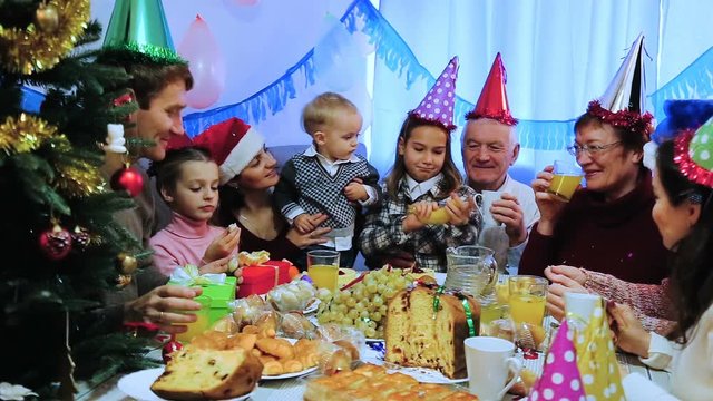 Large family enjoying their company during Christmas dinner
