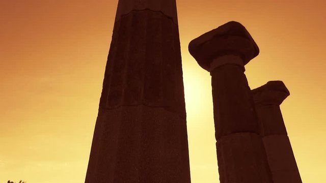 Antique column of the ancient city of Assos at sunset