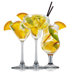 fresh fruit alcohol cocktail or mocktail in classic glass with ice cubes, orange and mint isolated on white background