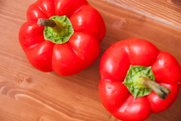 Red bell pepper on a wooden table